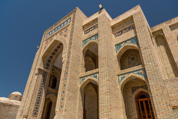 Fototapeta na wymiar Ancient minaret in the Old Town of Bukhara, Uzbekistan