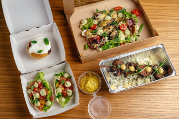 restaurant food in takeaway containers