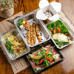 restaurant food in takeaway containers