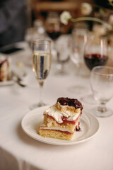 Wedding cake slice on elegant table setting