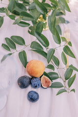 Fototapeta premium Fresh fruit and greenery on elegant table setting