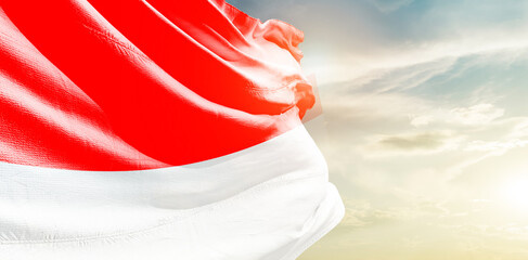 Indonesia national flag waving in the sky. - obrazy, fototapety, plakaty