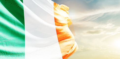 Ireland national flag waving in the sky. - obrazy, fototapety, plakaty