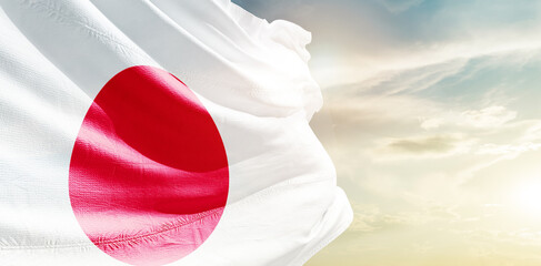 Japan national flag waving in the sky.
