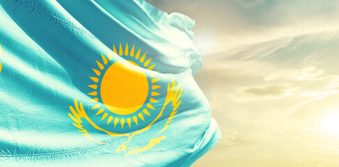 Kazakhstan national flag waving in the sky.