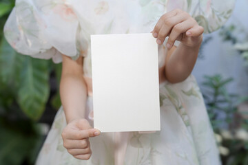 Hand showing card mockup, white blank space card, for greeting, table number, wedding invitation...