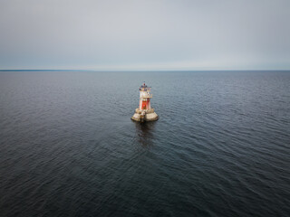 Fototapeta na wymiar A lighthouse in the Baltic Sea in the Gulf of Tallinn near Naissaar Island.