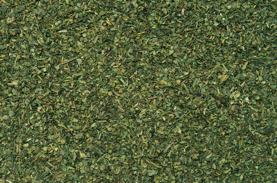 Dried Italian herbs, mixed herbs seasoning, top view background 