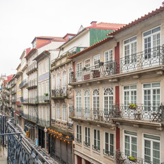 Porto building facade. Old fasioned facade windows and balconies of apartment buildings in Porto, Portugal.