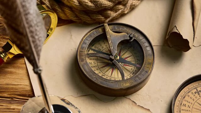 Antique Nautical Compasses on an Old World Map in Soft Lighting