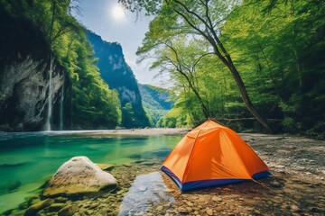 Camping on the shore of a mountain river with a tent - obrazy, fototapety, plakaty