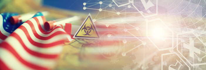 American flag, test tubes and biohazard sign. The concept of American biolabs and research centers.