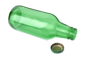 One empty green beer bottle and cap isolated on white