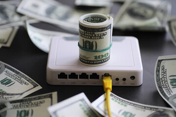 internet router and one hundred dollars. Communication and internet cost concept - obrazy, fototapety, plakaty