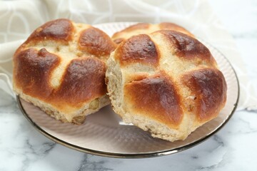 Hot cross buns on white marble table