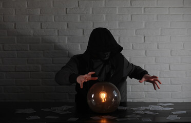 A man with a fortune teller ball
