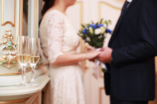 Portrait of emotional lovers of brides indoor.Bride and groom kisses tenderly . Emotional photo of a couple in love on the wedding day.