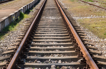 Obraz premium Old railway tracks closeup on sunny day