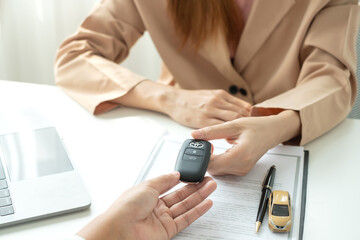 Car dealership provides advice about insurance details and car rental information and delivers the...