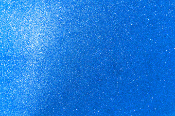 Abstract blurred blue glitter texture background, shiny blue glitter background