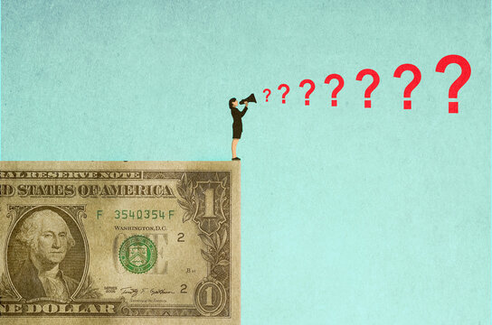 Businesswoman standing on oversized dollar and shouting questions through megaphone