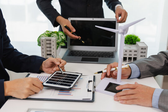 Creative business meeting for eco-friendly business Solar panels, green energy, business people working in a green environment friendly office, professional teaching, corporate people, sustainable ele