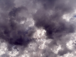 Fototapeta premium White fluffy cumulus clouds in the summer sky, natural clouds background
