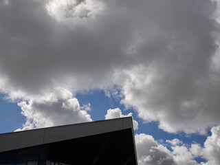 White cumulus clouds in the deep blue summer sky. Fluffy clouds background