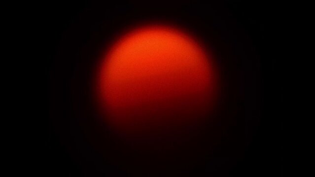 4k video animation, glowing red orb against a dark background