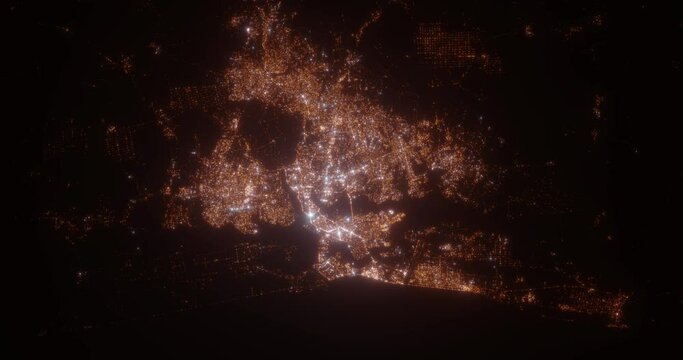 Abidjan (Ivory Coast) aerial view at night. View on modern city from space. Camera is zooming in, rotating counterclockwise
