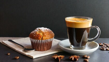 Espresso coffee with muffin on the side and a black background