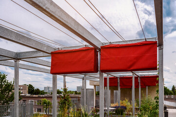 Pergola Awning on Roof Patio Garden. Modern Fabric Folding Pergola on Metal Frame Construction. 