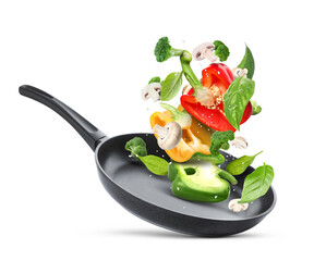 Obraz premium Frying pan with fresh ingredients in air on white background