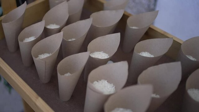 Wedding rice in paper cones on tray