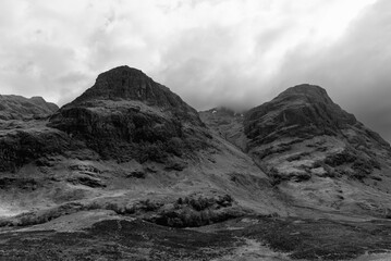 Dramatic shades of gray define the rugged landscape of the Three Sisters in Glen Coe, captured in a...