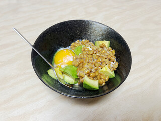 Mixed bowl of avocado, natto, and raw egg