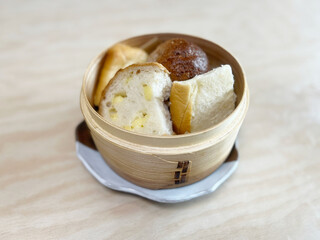 Variety bread steamed in a bamboo steamer
