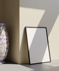 minimalist portrait frame mockup poster standing on the concrete floor and beige wall colored and vase decoration