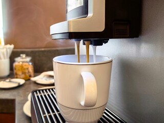 espresso machine pouring coffeecoffee at a coffee cup