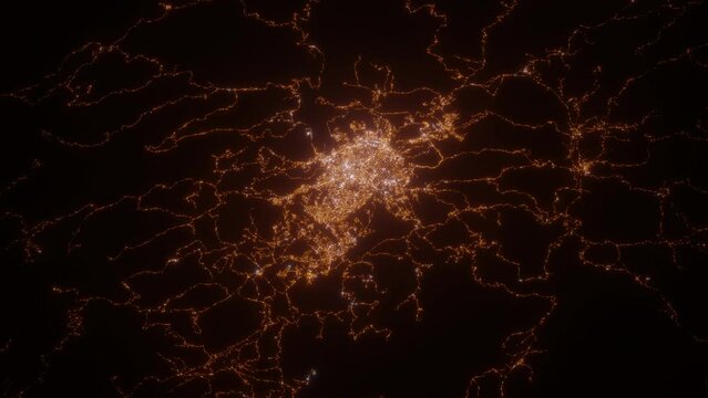 Sucre (Bolivia) aerial view at night. Top view on modern city with street lights. Camera is zooming out, rotating counterclockwise. Vertical video. The north is on the left side