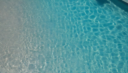 A close-up of the rippling and sparkling water surface of the pool seen from directly above. 真上から見た一面の波打って輝くプールの水面のクローズアップ
