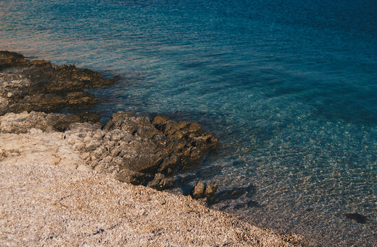 Detail of coast of Mediterranean Sea on pebble beach