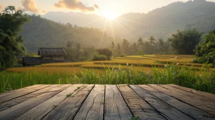 Foto op Canvas Wooden Table Overlooking Rice Field © olegganko