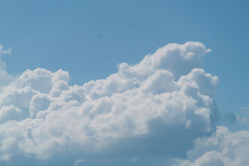 Clouds in the blue sky on a sunny day. Sunny sky background