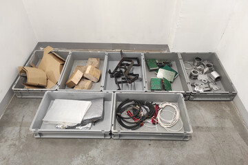 Eco. Garbage sorting by gray containers. Processing plant.