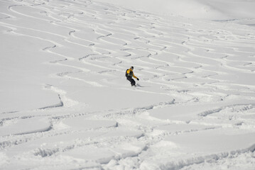 Ski, Snowboard freeride i deep powder snow. Gudauri Georgia Caucasus resort. Freeride in Caucasus mountains. Freeride snowboarding in winter. Heliboarding freeride. Riding in powder on snowborad.