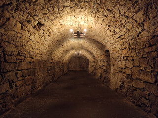 Dungeon of the old castle. Stone basement.