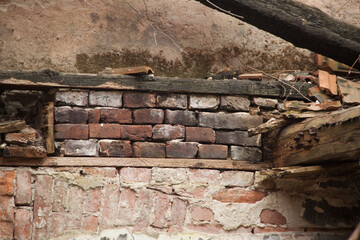 Texture of an old ragged wall background of old bricks and cracks in plaster yellow and brown tones