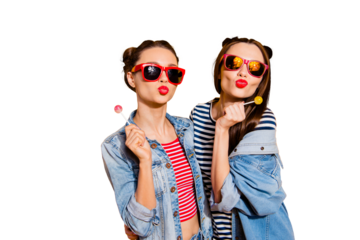 Close up portrait of two beautiful attractive pretty brunette hair lady in glasses spectacles send kiss isolated on yellow shine background hold sugar sweet yummy candy in hands