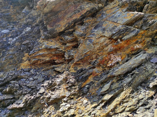 Geodesy. Stone texture. The rock is brown and red. Mineral background. Design from natural materials.